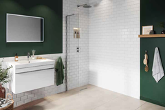 small wetroom panel in white tiled bathroom