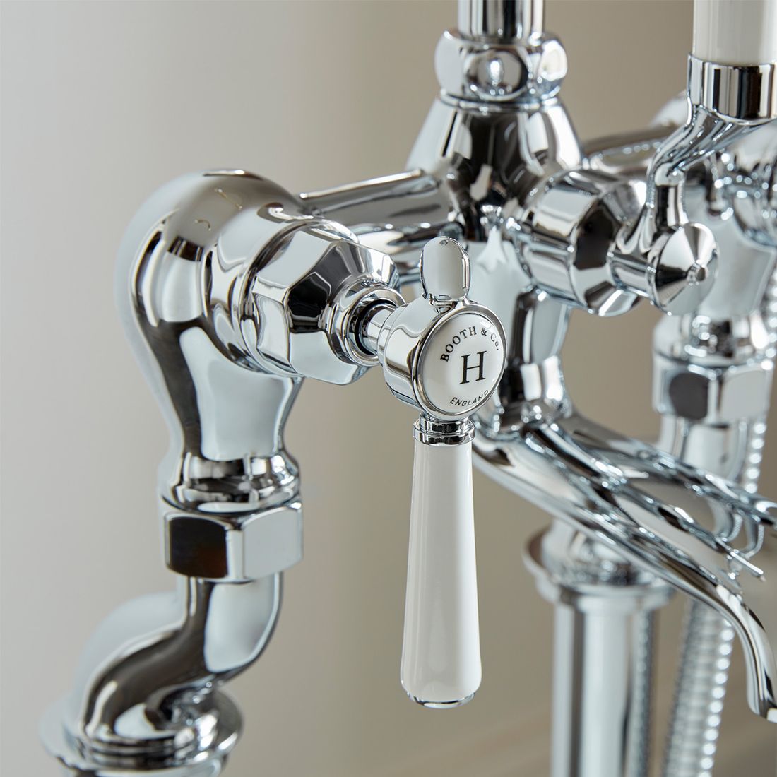 Chrome faucet with a visible brand logo on a neutral background